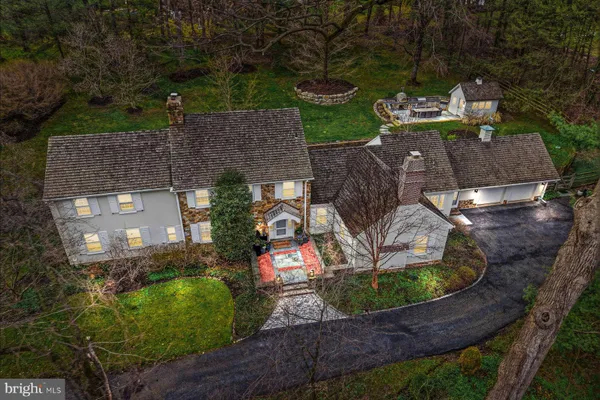 an aerial view of a house with outdoor space
