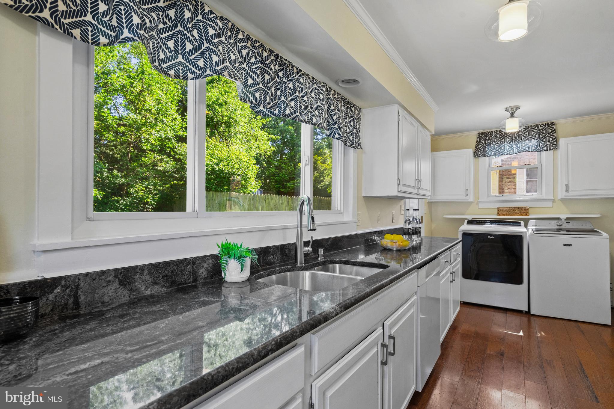 736 Dennis Avenue Silver Spring, MD 20901 - Photo 14 of 34 Washer / Dryer at end of kitchen