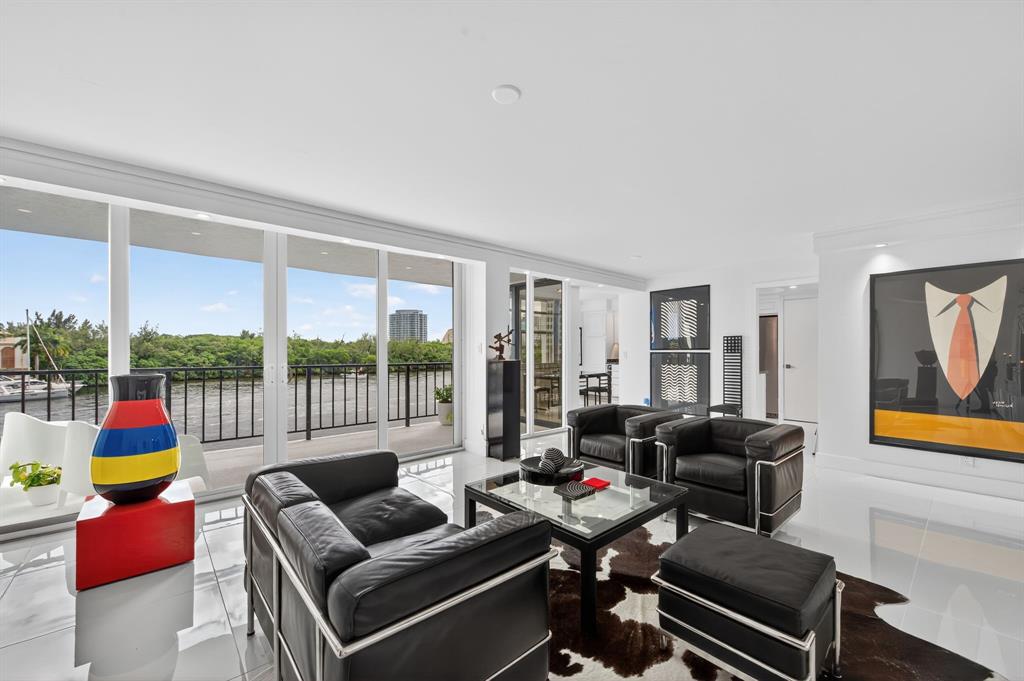 936 Intracoastal Drive, Unit 3C Fort Lauderdale, FL 33304 - Photo 11 of 82 a living room with furniture and floor to ceiling windows