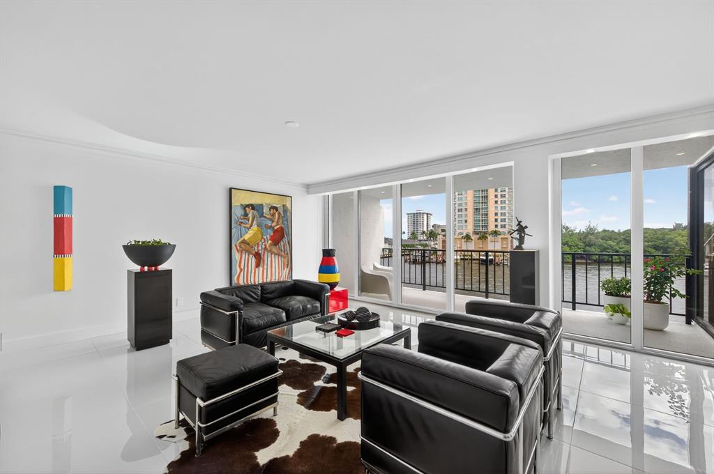 936 Intracoastal Drive, Unit 3C Fort Lauderdale, FL 33304 - Photo 14 of 82 a living room with furniture and a floor to ceiling window