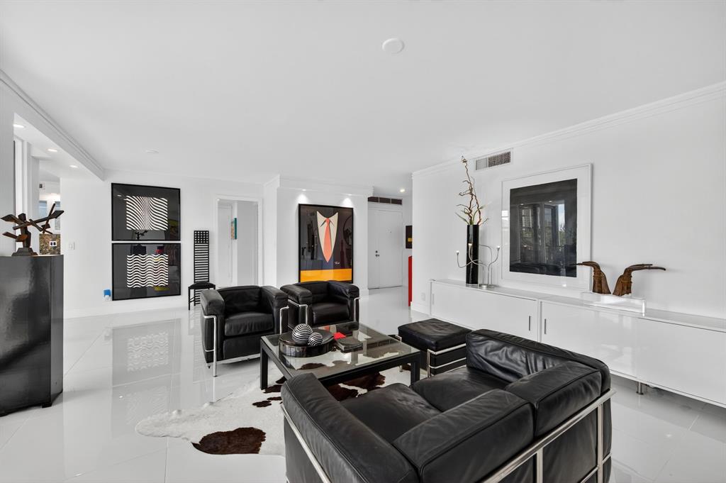 936 Intracoastal Drive, Unit 3C Fort Lauderdale, FL 33304 - Photo 15 of 82 a living room with furniture and a flat screen tv