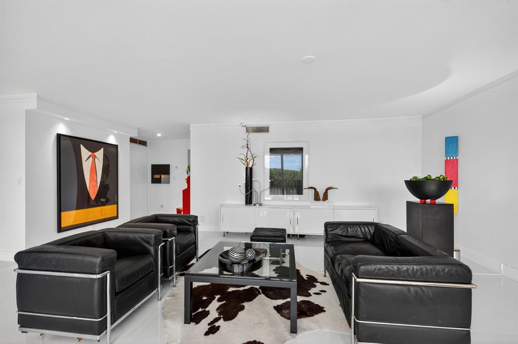 936 Intracoastal Drive, Unit 3C Fort Lauderdale, FL 33304 - Photo 16 of 82 a living room with furniture and a flat screen tv