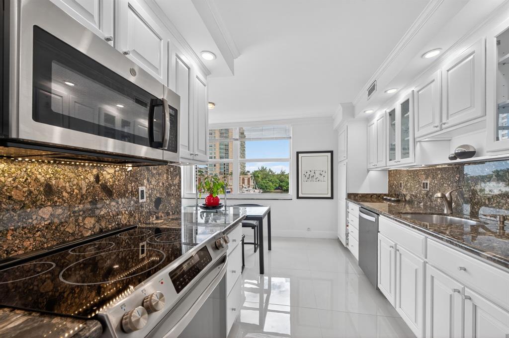 936 Intracoastal Drive, Unit 3C Fort Lauderdale, FL 33304 - Photo 22 of 82 a kitchen with stainless steel appliances a stove a sink and a microwave