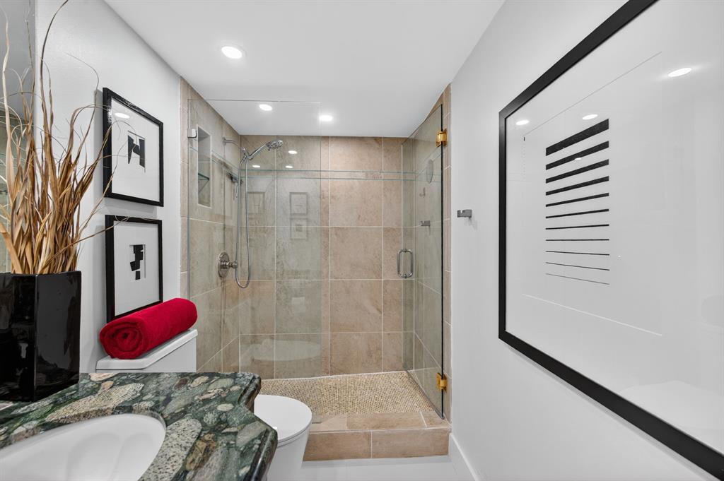 936 Intracoastal Drive, Unit 3C Fort Lauderdale, FL 33304 - Photo 27 of 82 a bathroom with a granite countertop sink a toilet and shower