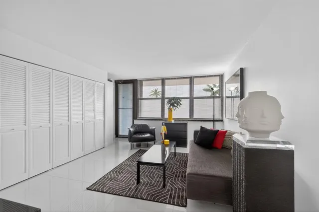 a view of a livingroom with furniture and windows