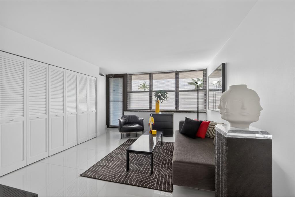 936 Intracoastal Drive, Unit 3C Fort Lauderdale, FL 33304 - Photo 29 of 82 a living room with furniture and a large window