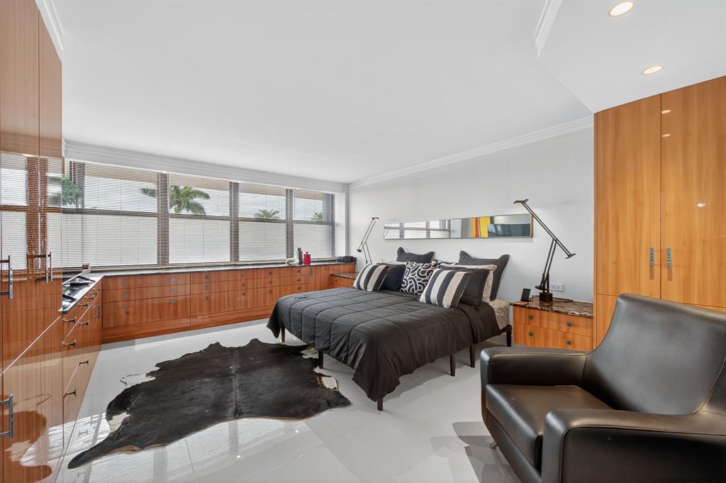 936 Intracoastal Drive, Unit 3C Fort Lauderdale, FL 33304 - Photo 34 of 82 a bedroom with furniture and a large window