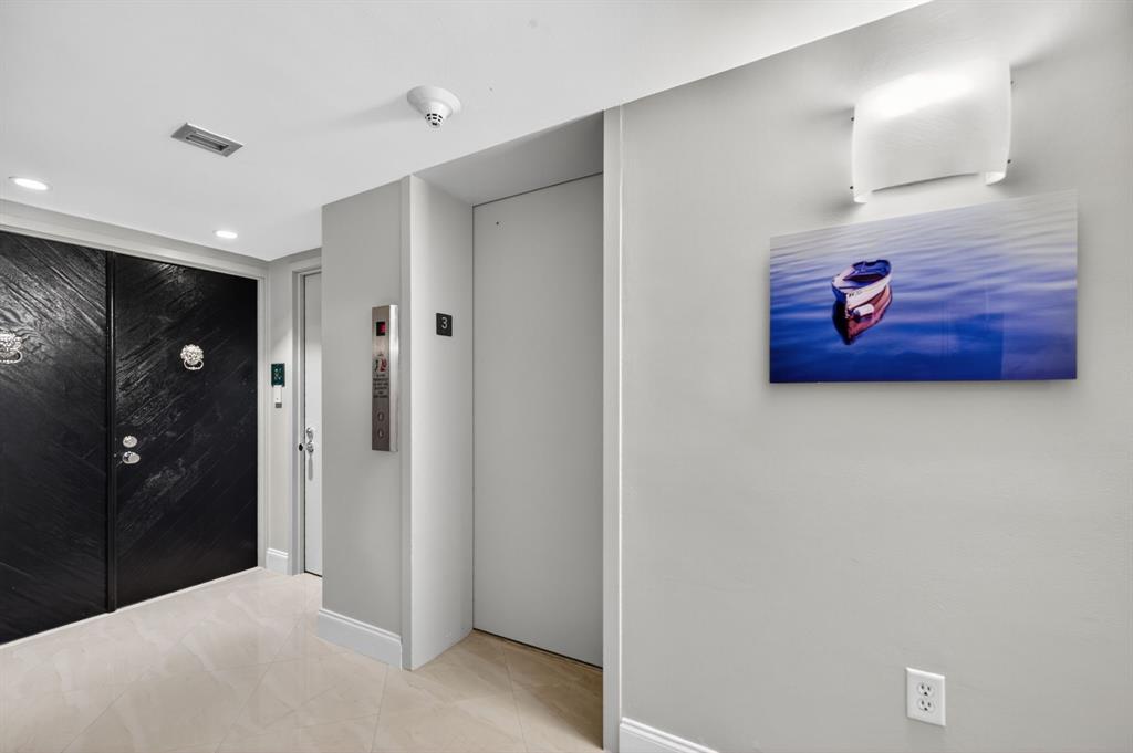 936 Intracoastal Drive, Unit 3C Fort Lauderdale, FL 33304 - Photo 5 of 82 a view of a hallway with wooden floor