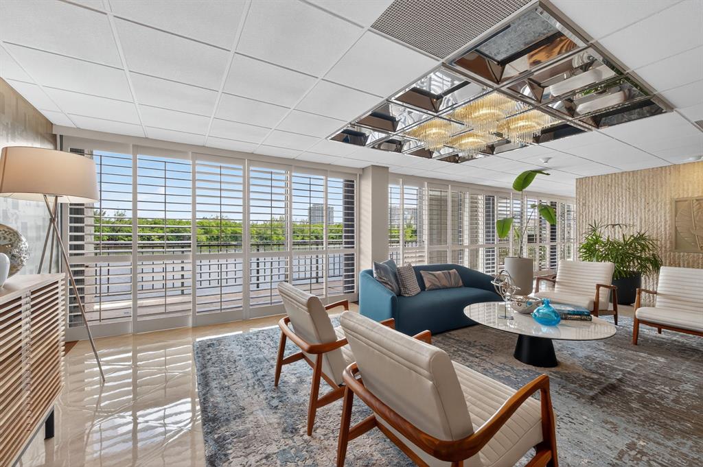 936 Intracoastal Drive, Unit 3C Fort Lauderdale, FL 33304 - Photo 66 of 82 a living room with furniture and a flat screen tv