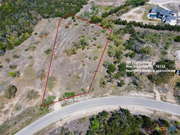 an aerial view of a backyard of a house