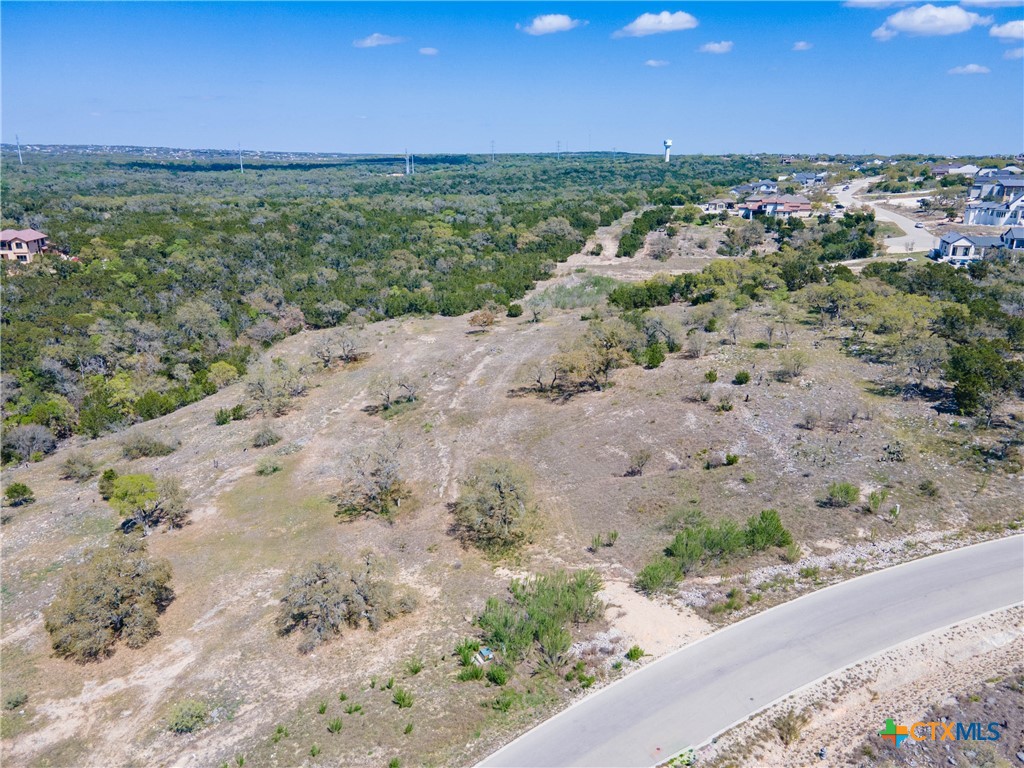 5922 Colin Ridge New Braunfels, TX 78132 - Photo 16 of 32 a view of a dry yard with wooden fence and floor