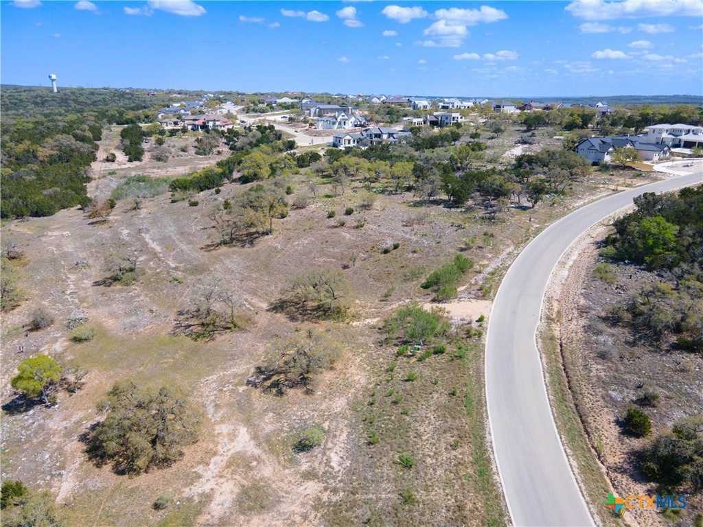 5922 Colin Ridge New Braunfels, TX 78132 - Photo 18 of 32 a view of a dry yard with wooden fence