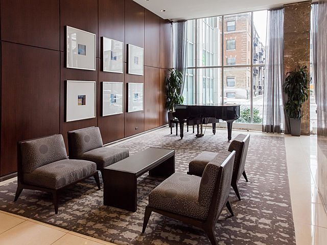 655 West Irving Park Road, Unit 3206 Chicago, IL 60613 - Photo 3 of 20 a living room with furniture and large windows