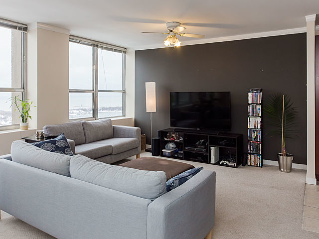 655 West Irving Park Road, Unit 3206 Chicago, IL 60613 - Photo 6 of 20 a living room with furniture and a flat screen tv