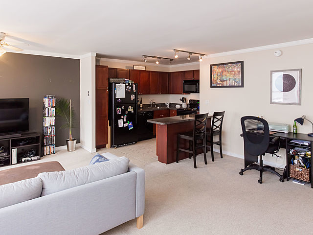 655 West Irving Park Road, Unit 3206 Chicago, IL 60613 - Photo 8 of 20 a living room with furniture and a flat screen tv