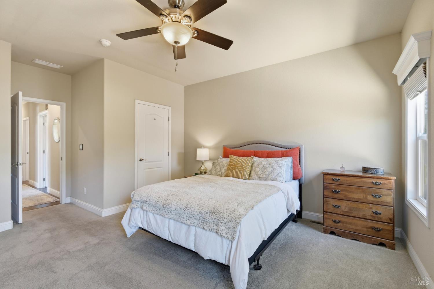 120 Shamrock Circle Santa Rosa, CA 95403 - Photo 25 of 45 a bedroom with a bed and ceiling fan