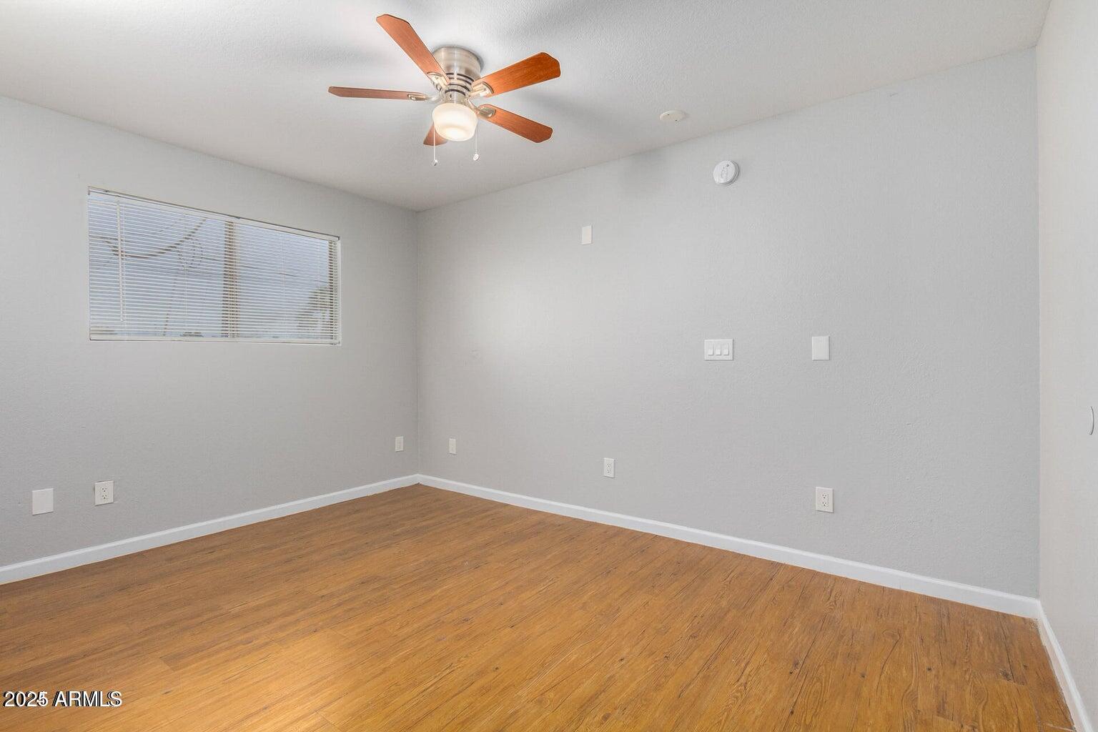 18202 North Cave Creek Road, Unit 134 Phoenix, AZ 85032 - Photo 4 of 10 a view of an empty room with a window