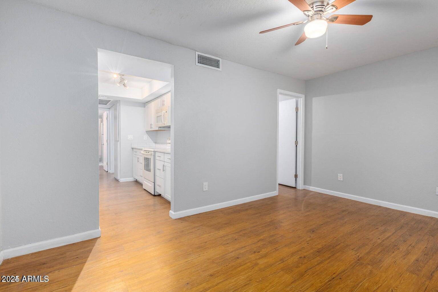 18202 North Cave Creek Road, Unit 134 Phoenix, AZ 85032 - Photo 6 of 10 a view of an empty room with a window