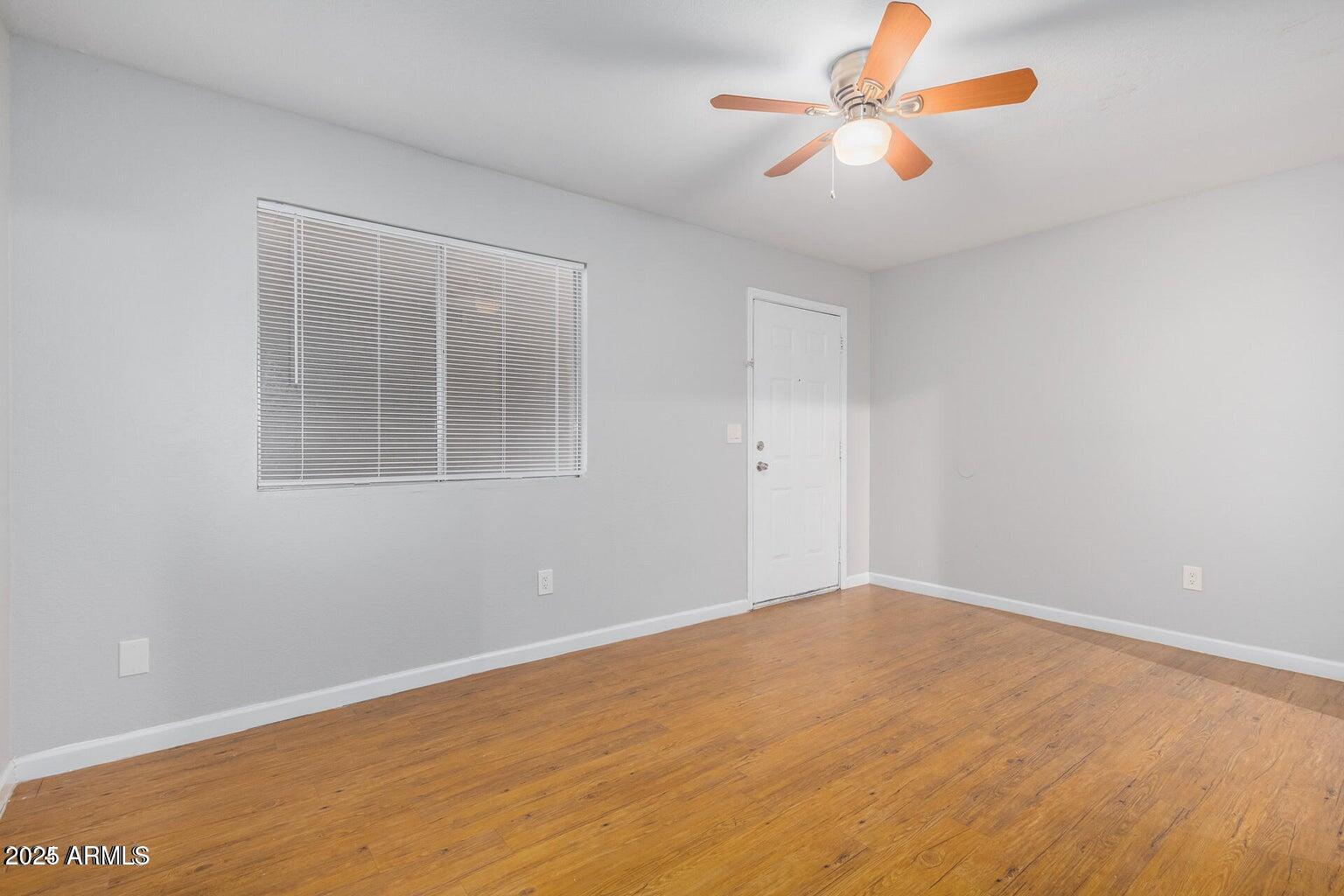 18202 North Cave Creek Road, Unit 134 Phoenix, AZ 85032 - Photo 8 of 10 a view of an empty room with a window