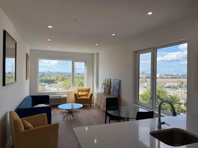 a living room with furniture and a large window