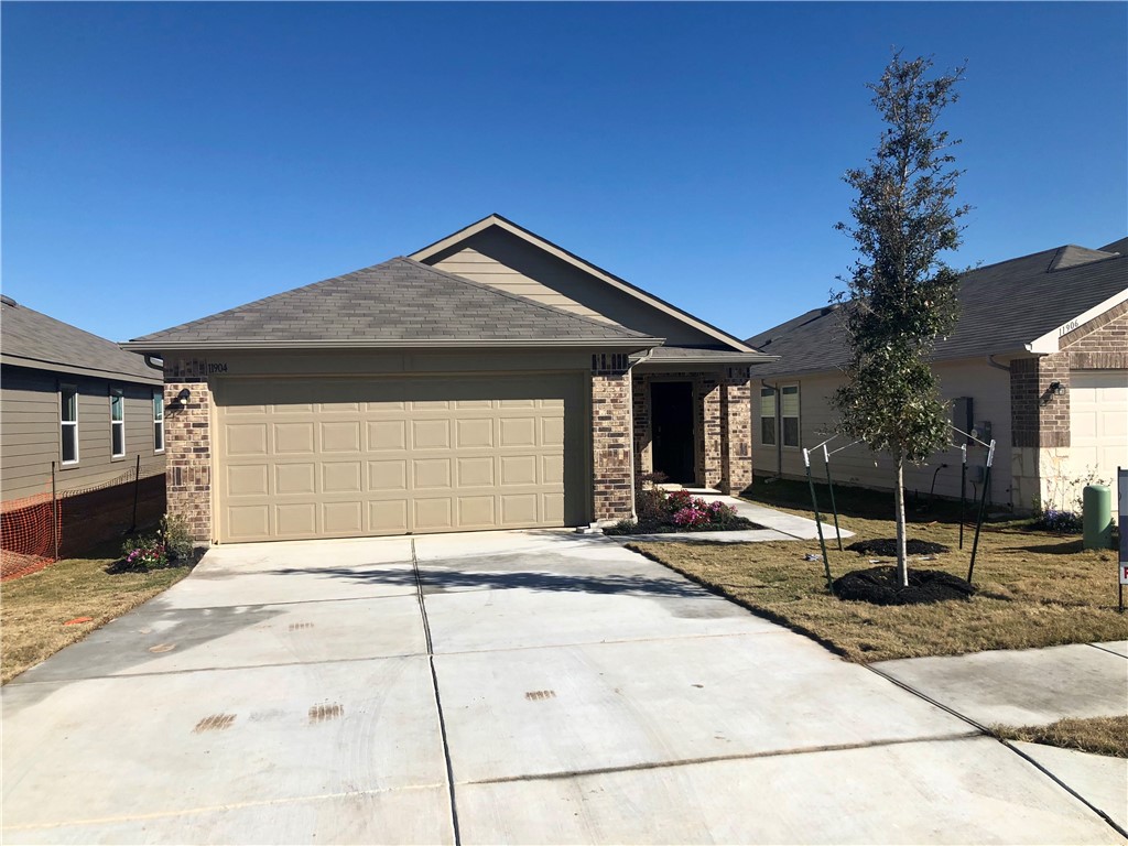 11904 Pyrite Road Manor, TX 78653 - Photo 1 of 1 a backyard of a house with seating space and yard