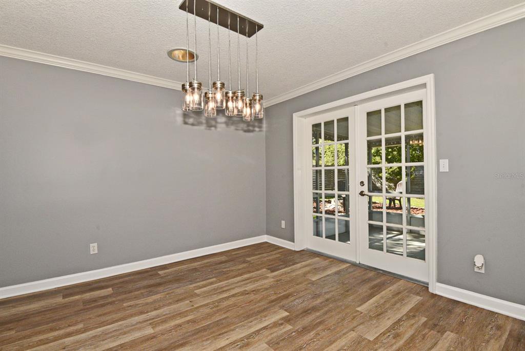 2717 Scarlet Road Winter Park, FL 32792 - Photo 11 of 31 a view of empty room with wooden floor and fan