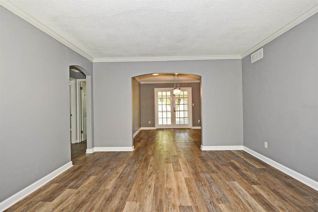 2717 Scarlet Road Winter Park, FL 32792 - Photo 12 of 31 a view of empty room with wooden floor and fan