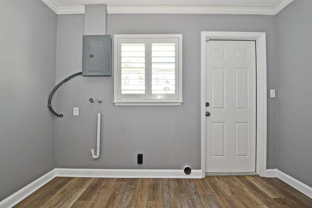 2717 Scarlet Road Winter Park, FL 32792 - Photo 13 of 31 a view of a room with wooden floor and windows
