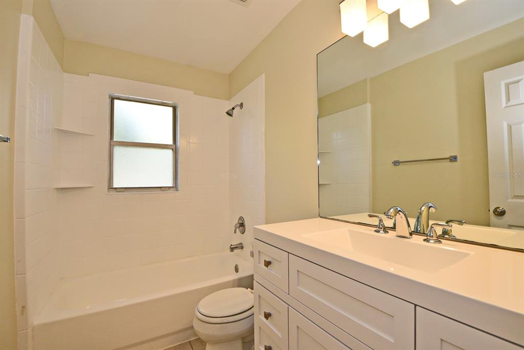 2717 Scarlet Road Winter Park, FL 32792 - Photo 16 of 31 a bathroom with a sink a toilet and shower