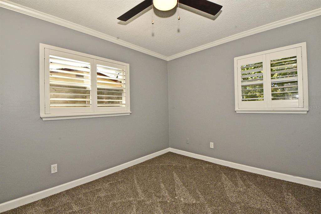 2717 Scarlet Road Winter Park, FL 32792 - Photo 17 of 31 a room with a window and ceiling fan