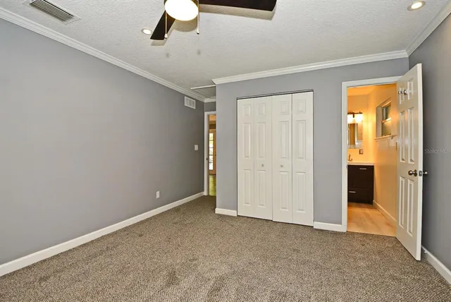 an empty room with a empty space and windows