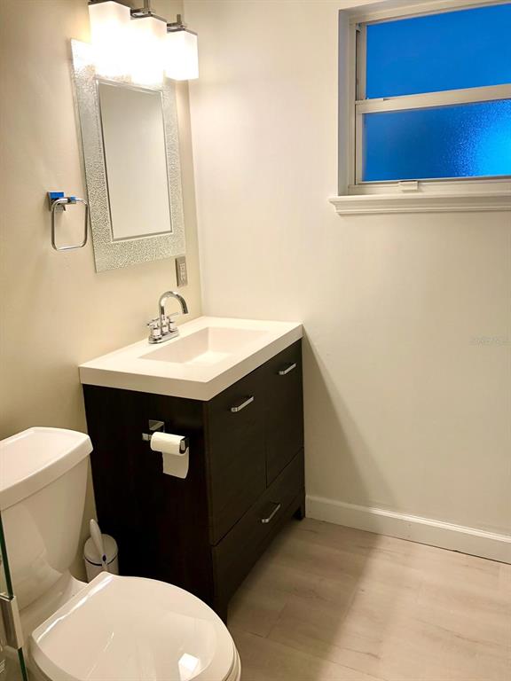 2717 Scarlet Road Winter Park, FL 32792 - Photo 26 of 31 a bathroom with a sink vanity mirror and toilet