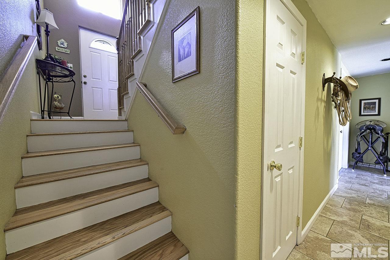 1597 Bonanza Road Reno, NV 89521 - Photo 23 of 28 a view of a hallway with wooden floor and entryway