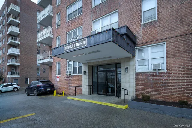a car parked in front of a brick building