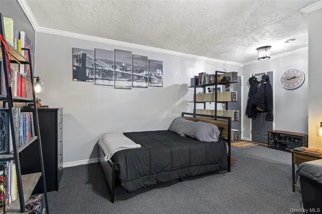 a bedroom with a bed a mirror and book shelf
