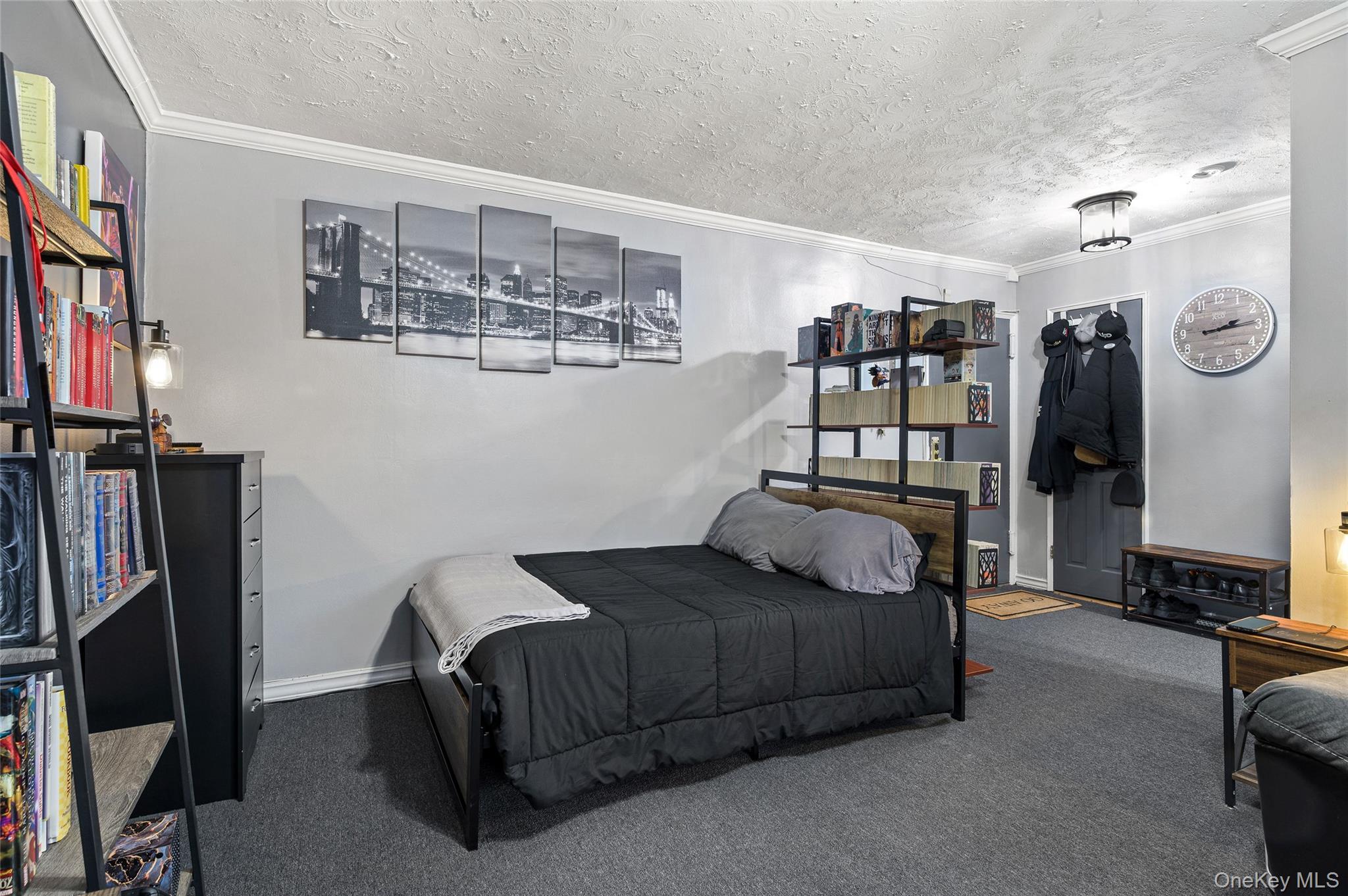 365 Bronx River Road, Unit 7C Yonkers, NY 10704 - Photo 5 of 13 a bedroom with a bed a mirror and book shelf