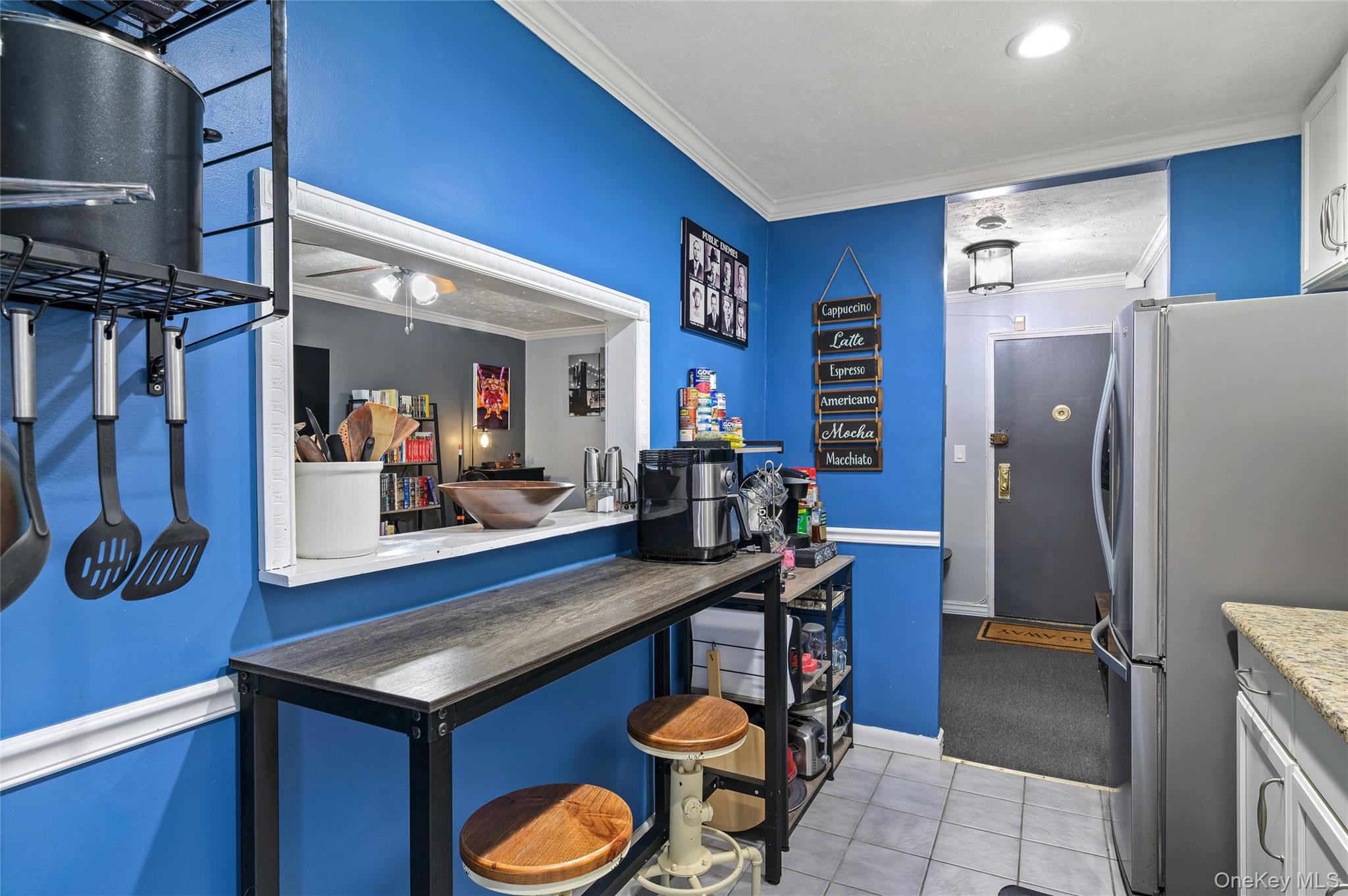 365 Bronx River Road, Unit 7C Yonkers, NY 10704 - Photo 8 of 13 a kitchen with stainless steel appliances a sink cabinets and wooden floor