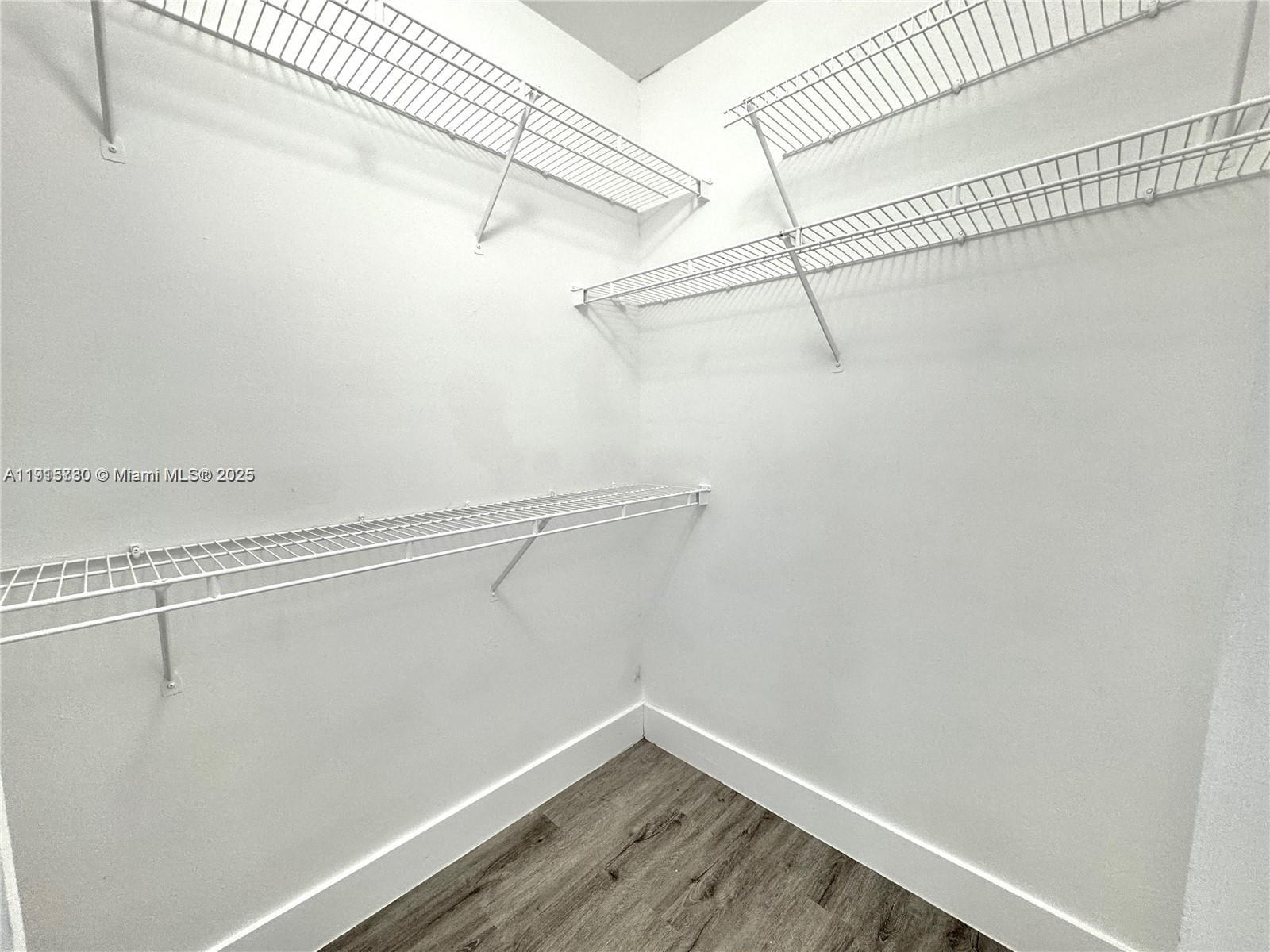 677 Southwest 111th Avenue, Unit 303 Pembroke Pines, FL 33025 - Photo 12 of 19 a view of a room with racks on the wall