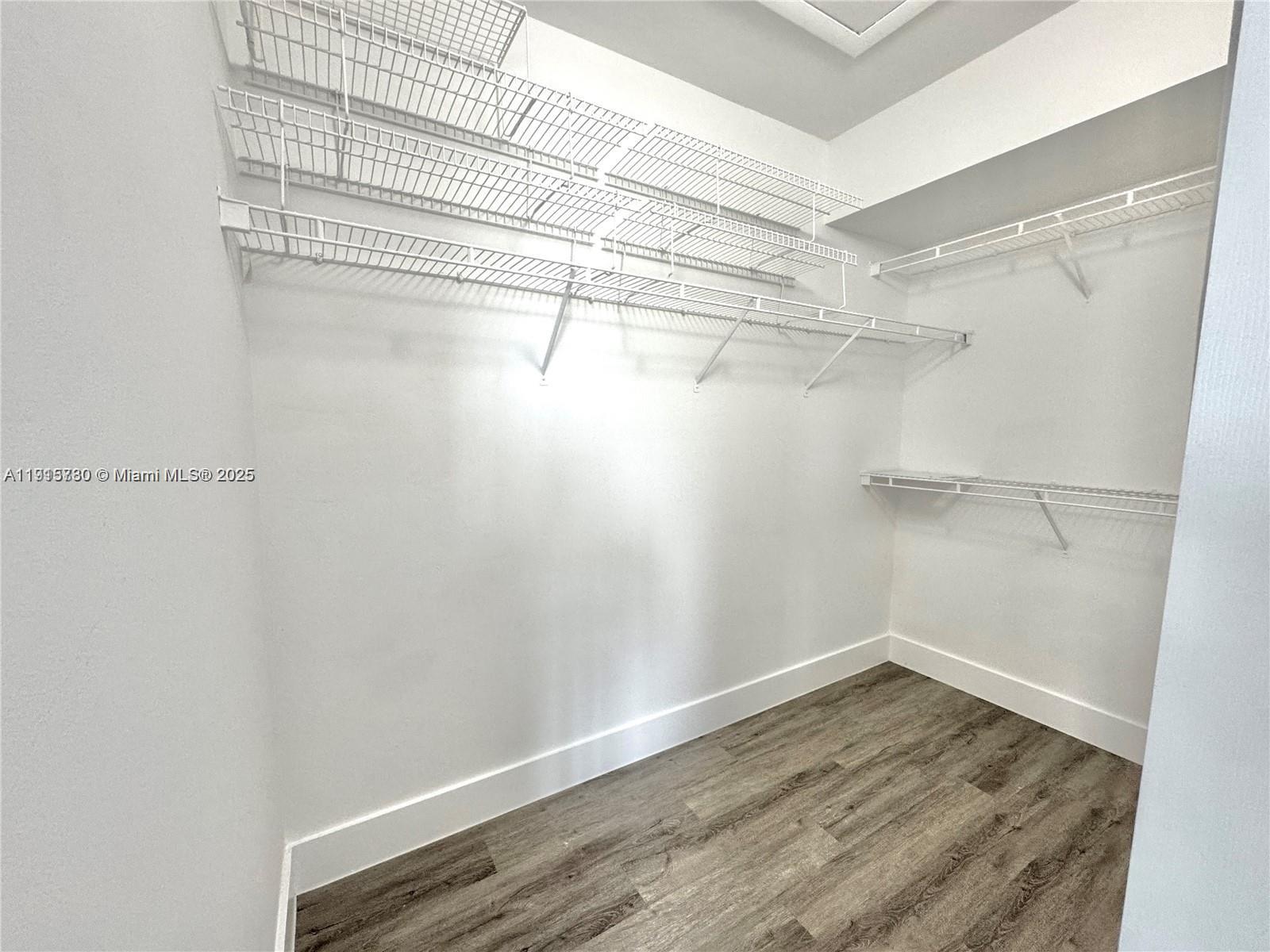 677 Southwest 111th Avenue, Unit 303 Pembroke Pines, FL 33025 - Photo 14 of 19 a view of a room with racks on the wall