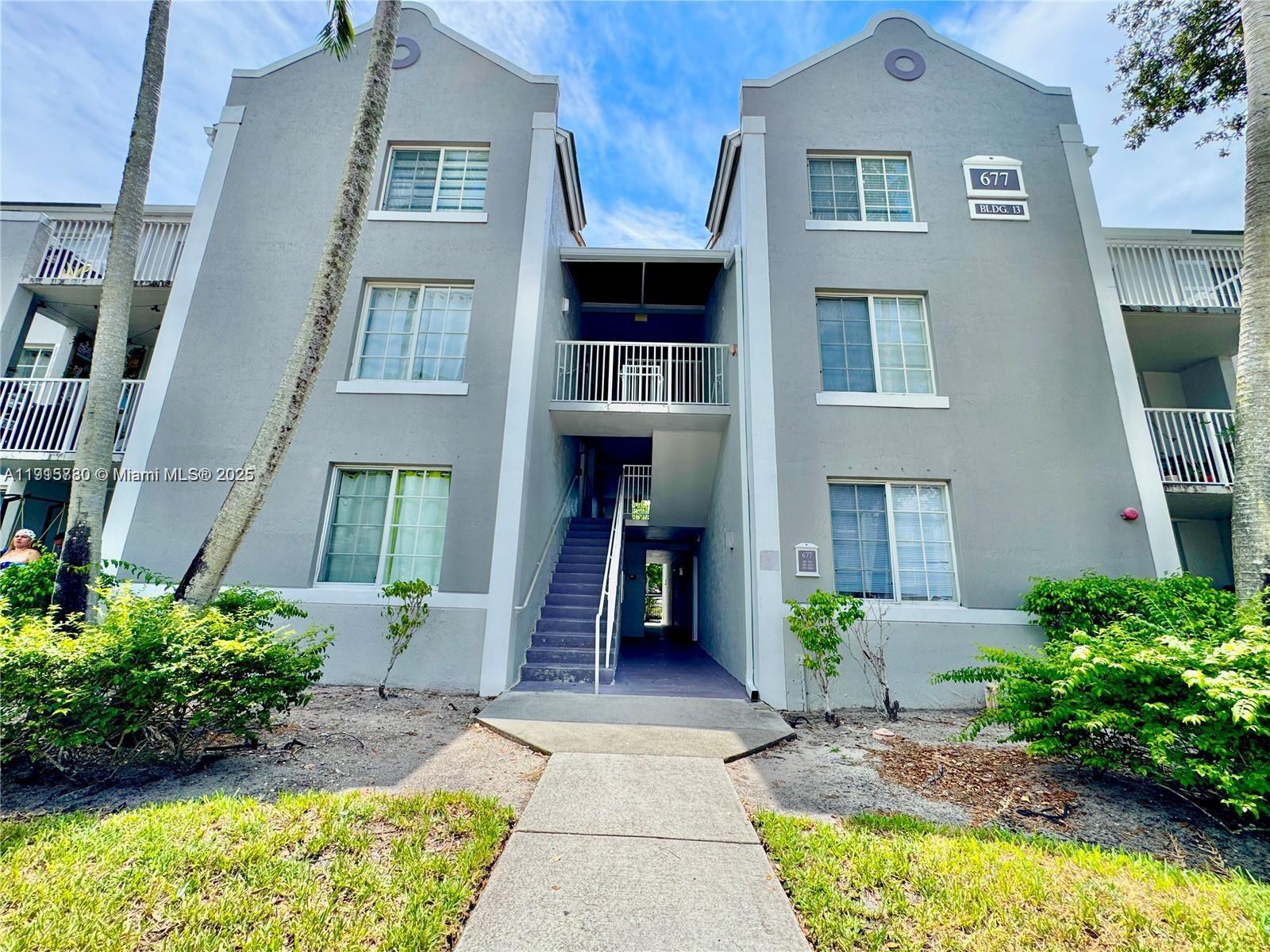 677 Southwest 111th Avenue, Unit 303 Pembroke Pines, FL 33025 - Photo 19 of 19 a front view of a house
