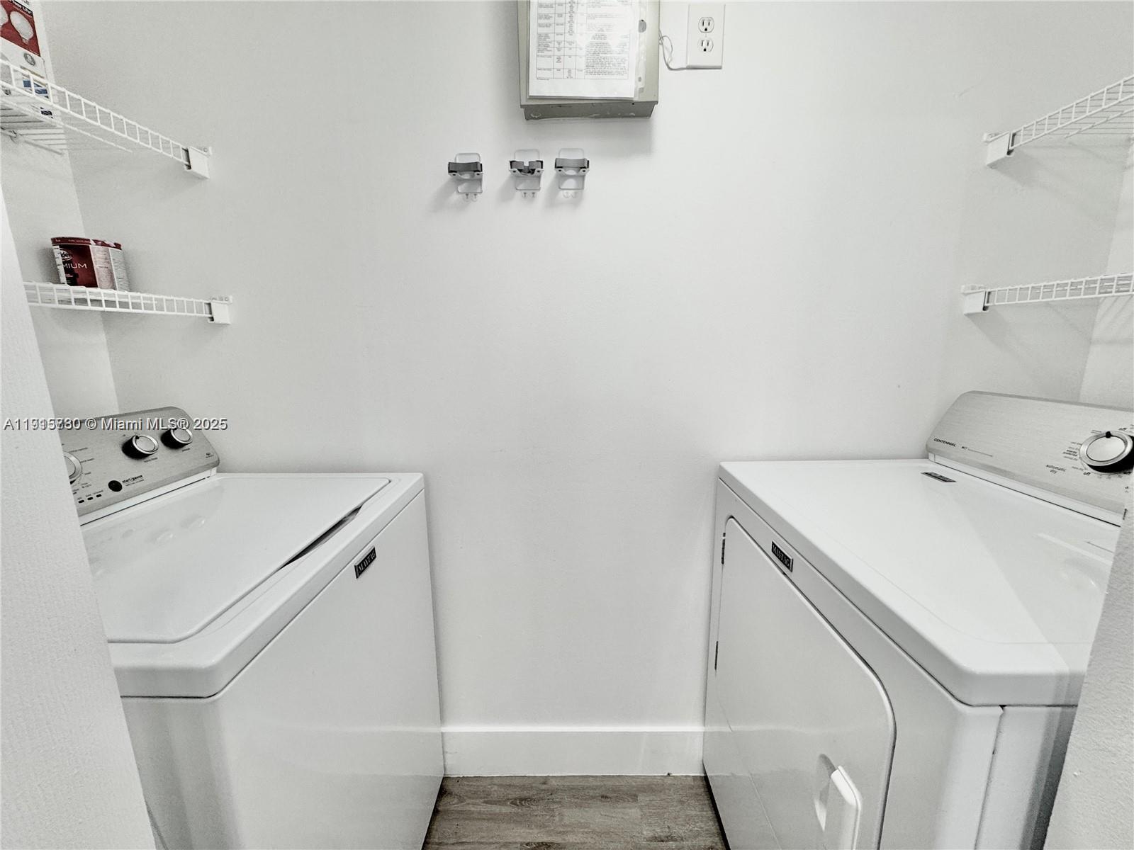 677 Southwest 111th Avenue, Unit 303 Pembroke Pines, FL 33025 - Photo 6 of 19 a utility room with dryer and washer