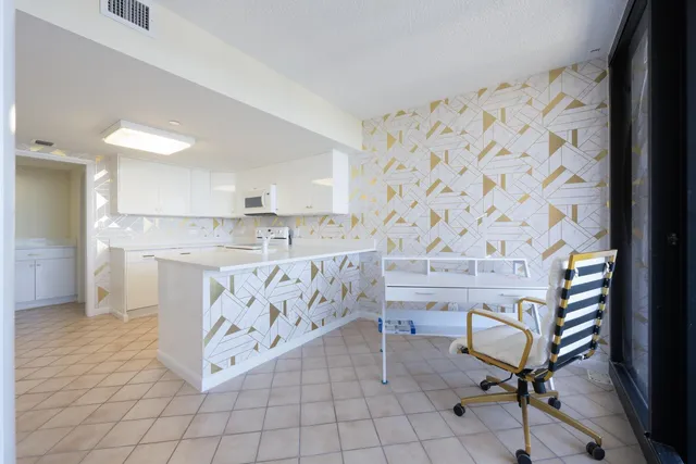 a view of kitchen with cabinets and outdoor space