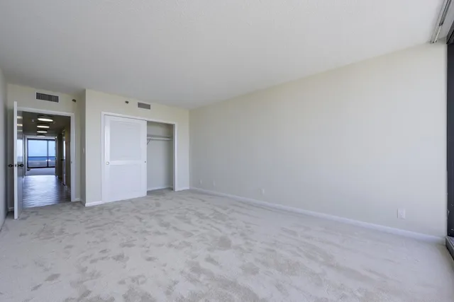 a view of an empty room and closet
