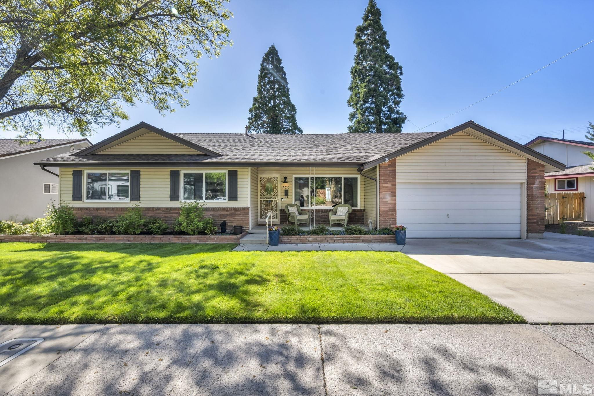 770 Rhode Island Drive Reno, NV 89503 - Photo 1 of 19 a front view of a house with a garden