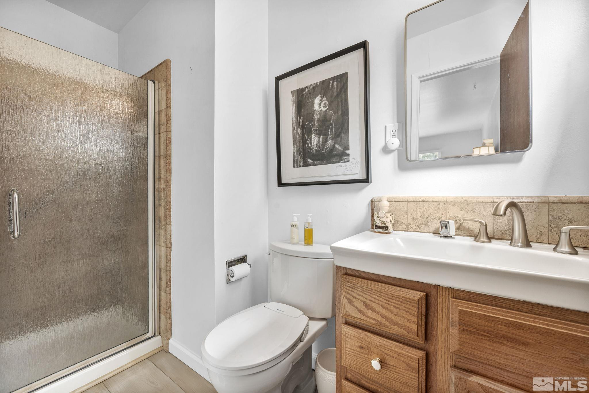 770 Rhode Island Drive Reno, NV 89503 - Photo 11 of 19 a bathroom with a toilet a sink and mirror