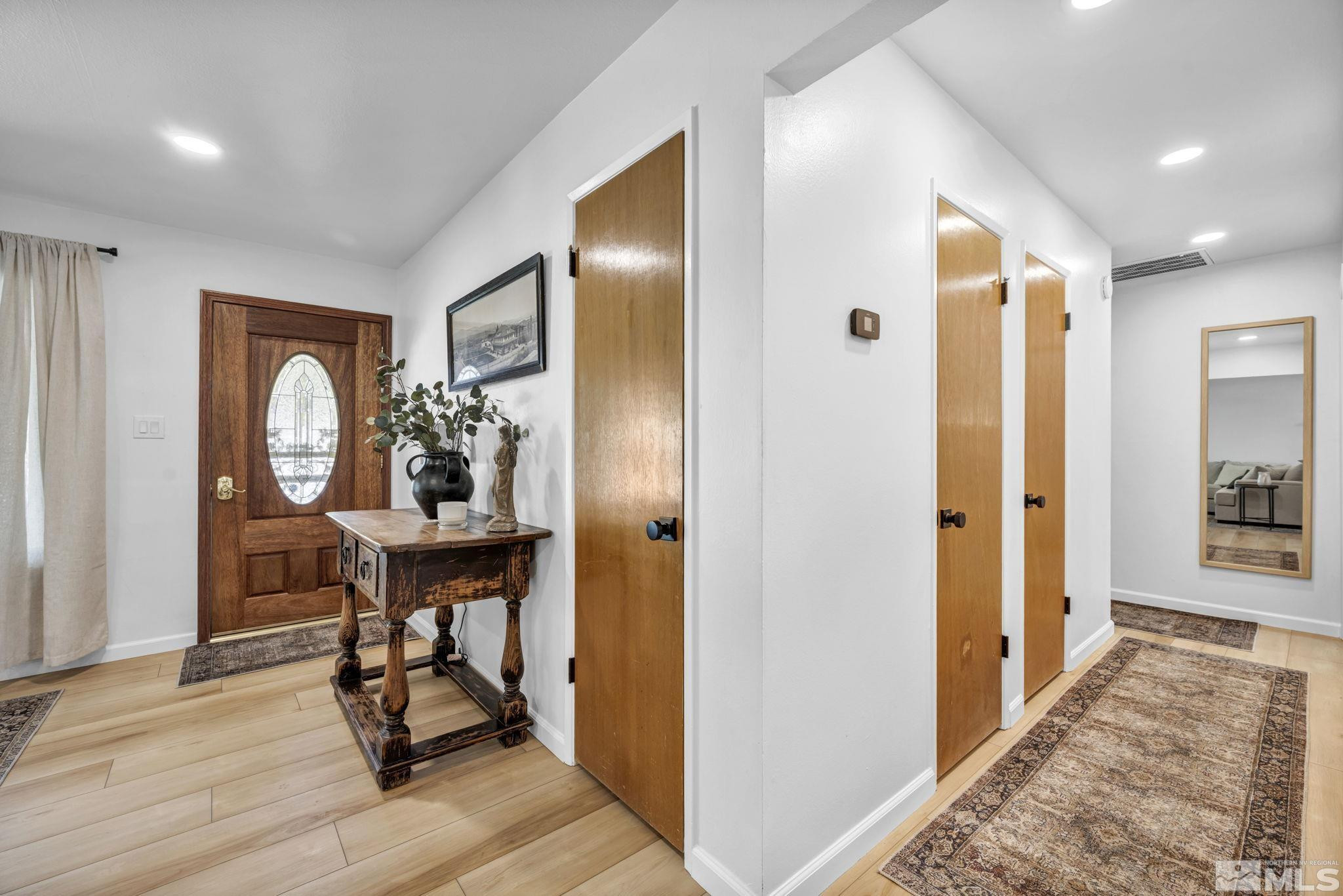770 Rhode Island Drive Reno, NV 89503 - Photo 12 of 19 a view of a hallway and dining room with wooden floor