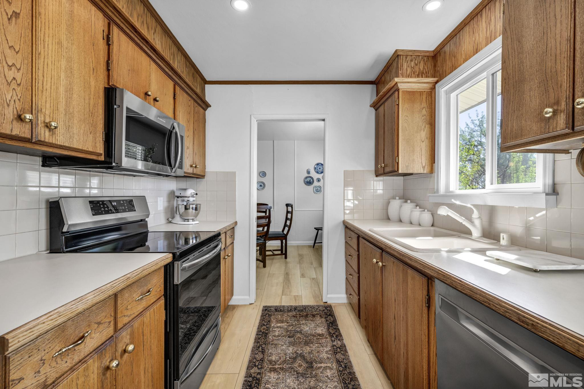 770 Rhode Island Drive Reno, NV 89503 - Photo 16 of 19 a kitchen with a sink stove and microwave