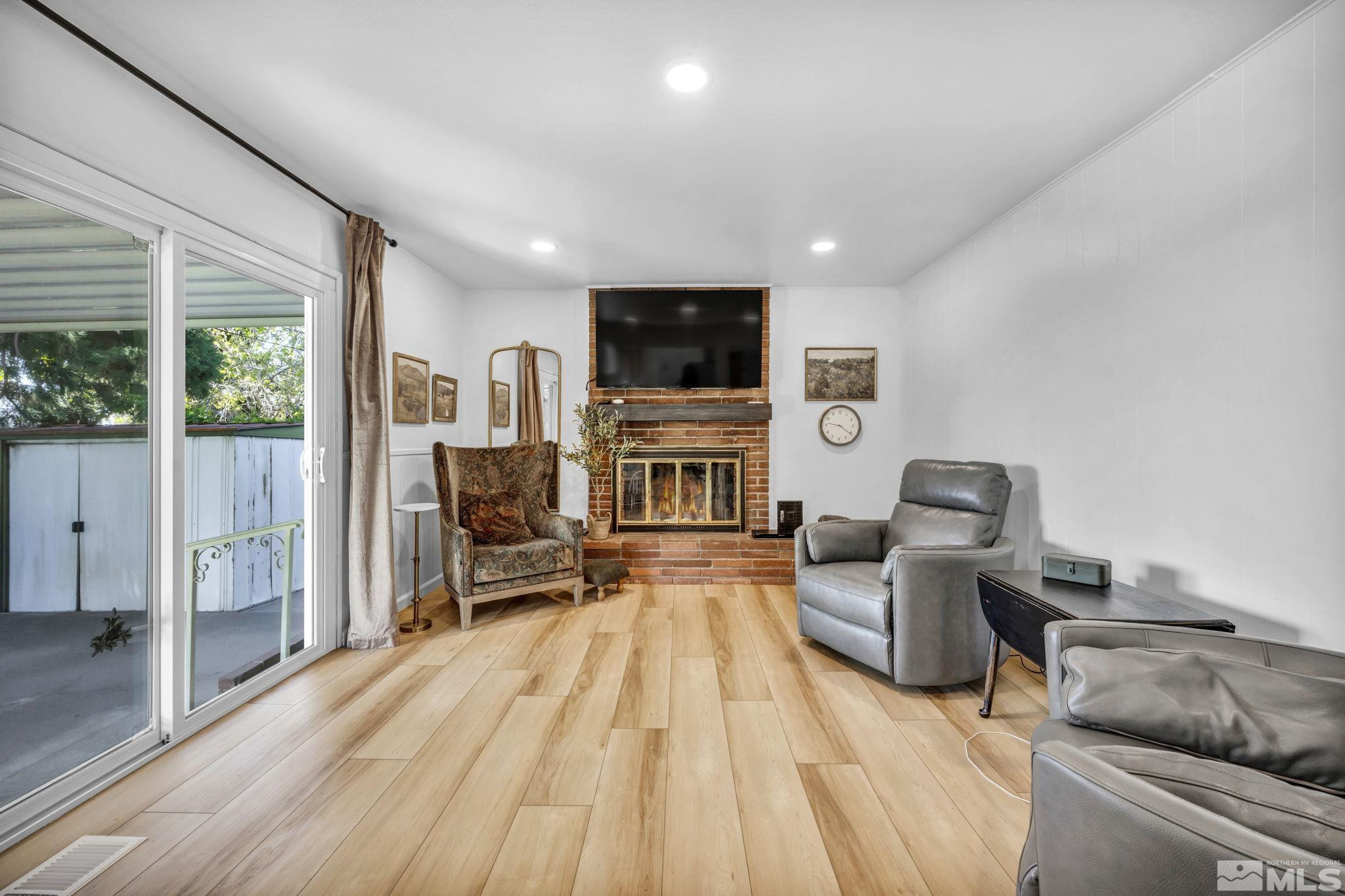 770 Rhode Island Drive Reno, NV 89503 - Photo 18 of 19 a living room with fireplace furniture and a flat screen tv