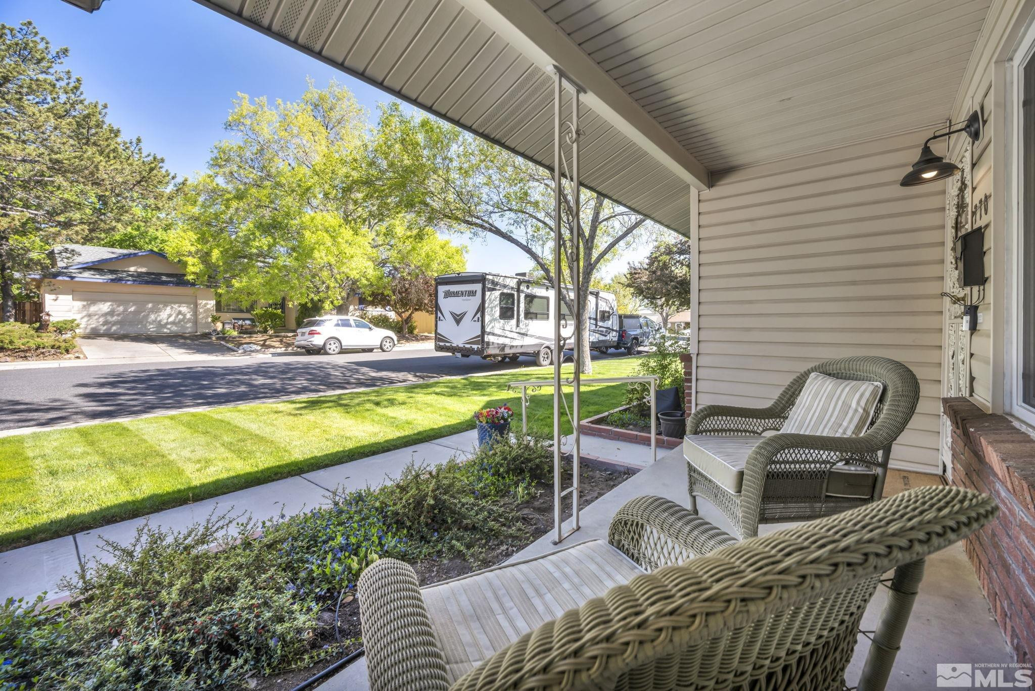 770 Rhode Island Drive Reno, NV 89503 - Photo 2 of 19 a view of a swimming pool with chairs in patio