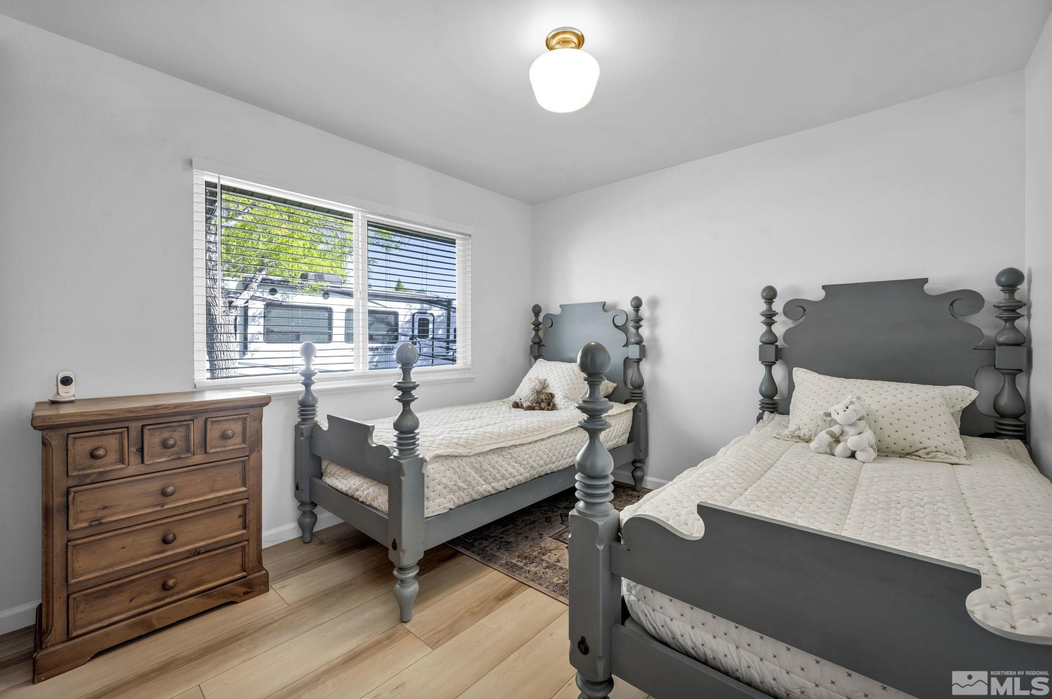 770 Rhode Island Drive Reno, NV 89503 - Photo 8 of 19 a bedroom with a bed and windows